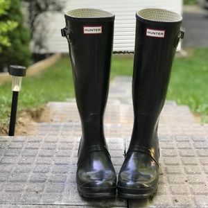 Shiny black Hunter tall rain boots.
